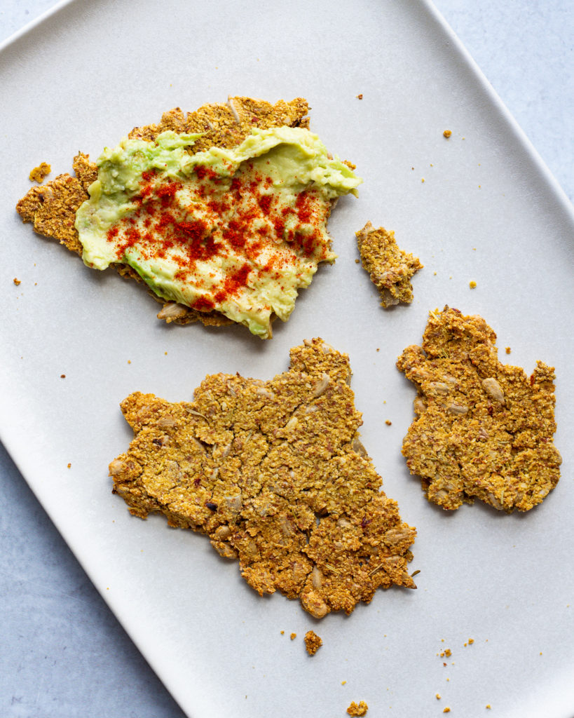 gluten free crackers with avocado and paprika
