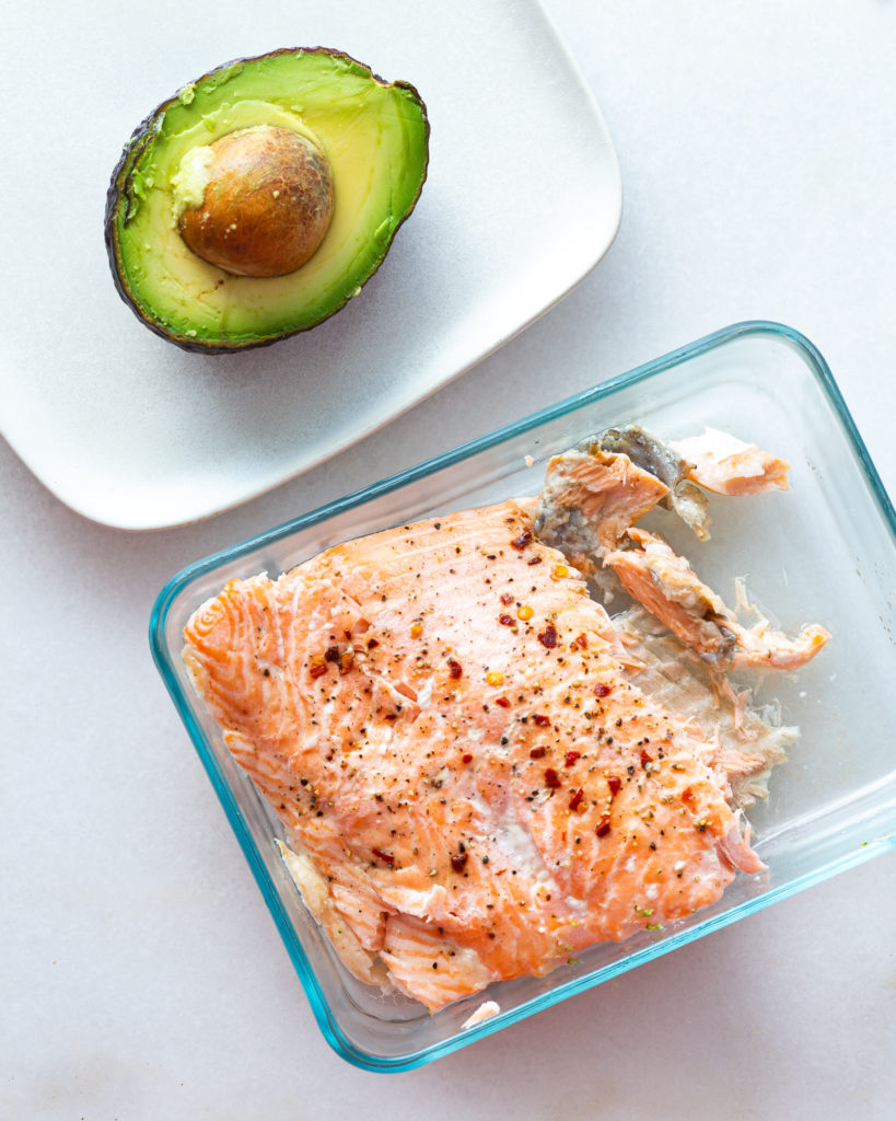 halved avocado and baked salmon