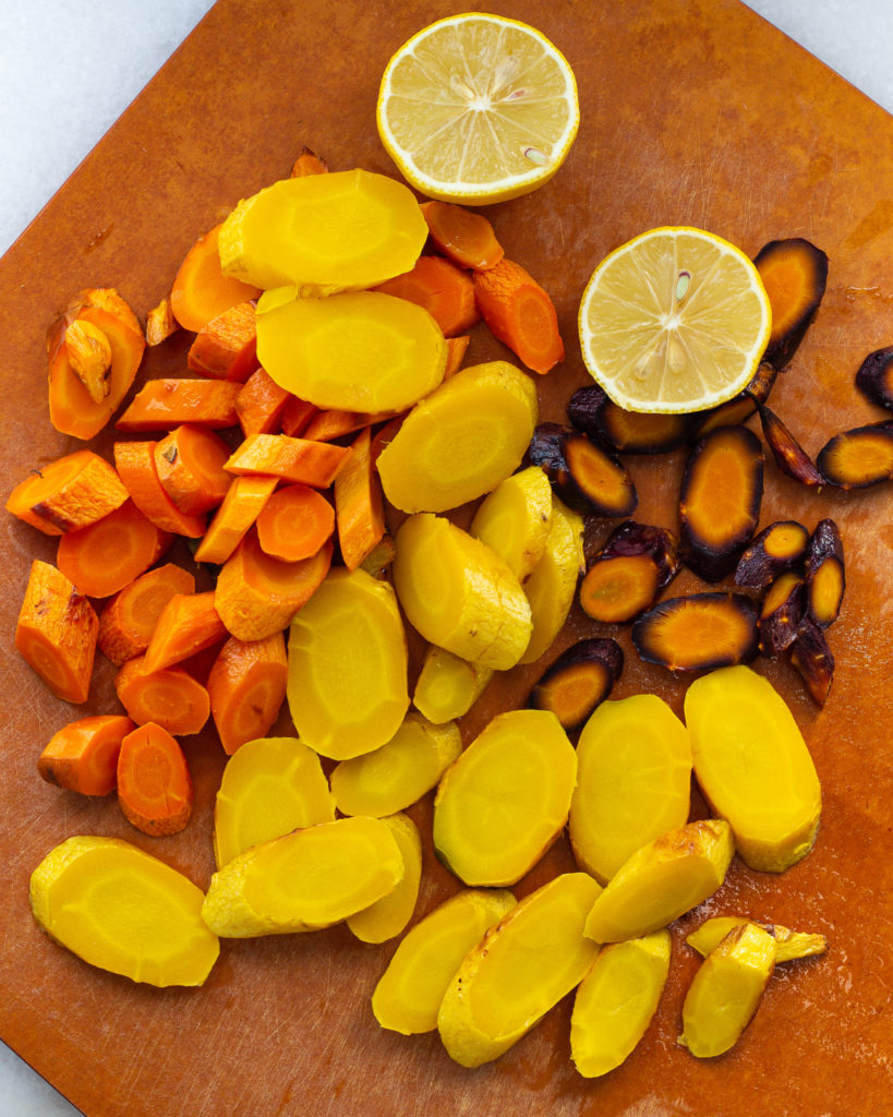 sliced roasted carrots and halved lemon