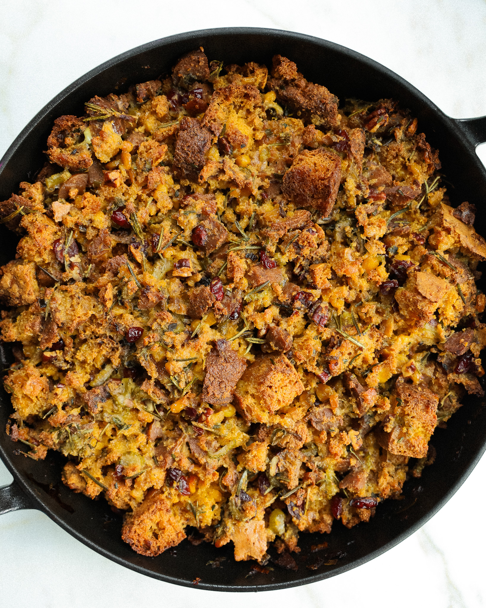 Vegetarian Cornbread and cranberry stuffing in a skillet