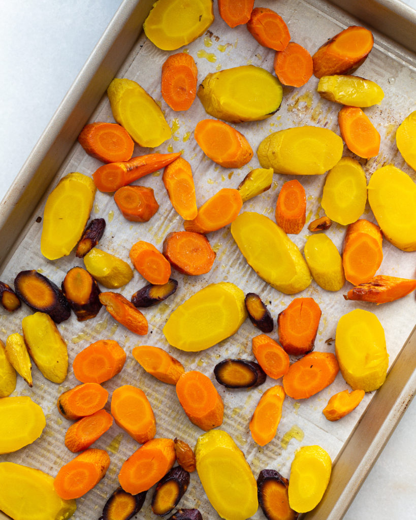 sliced carrots on baking sheet