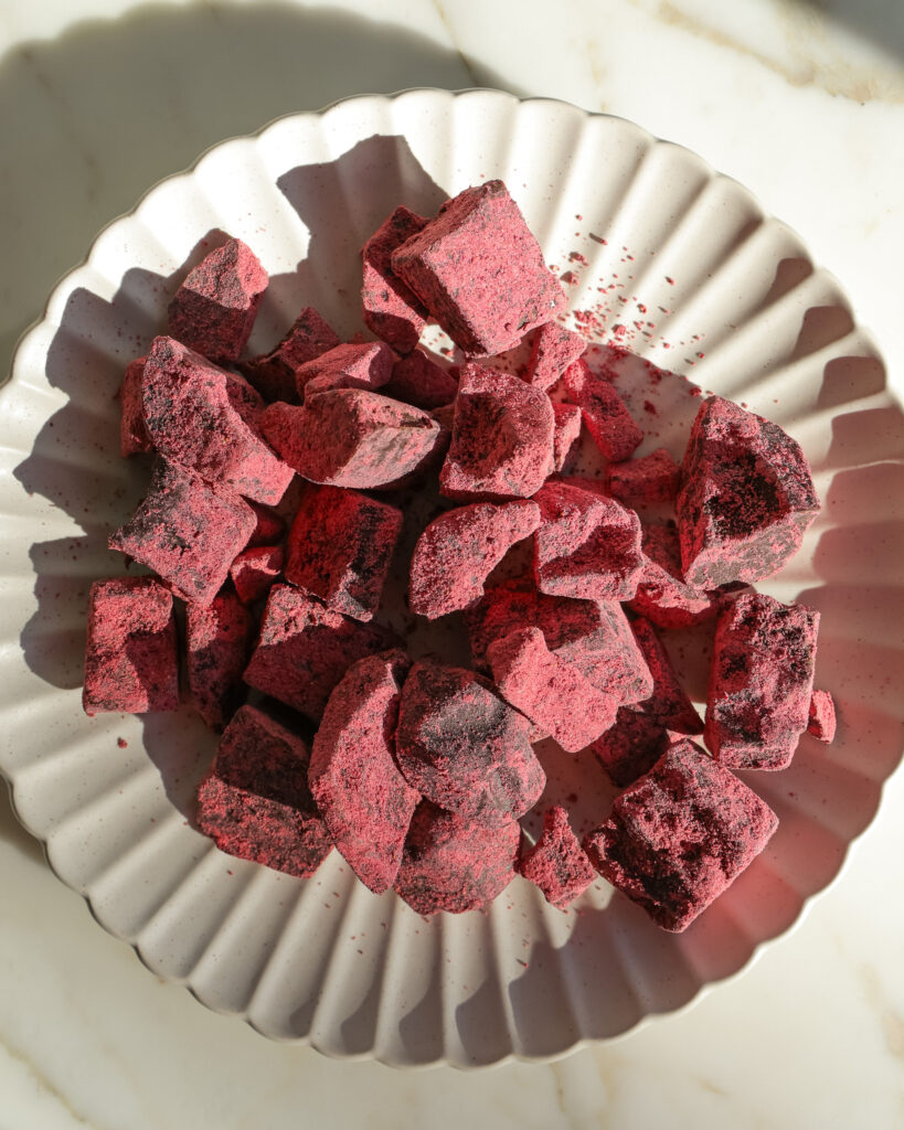 Chopped strawberry chocolate truffles on a plate