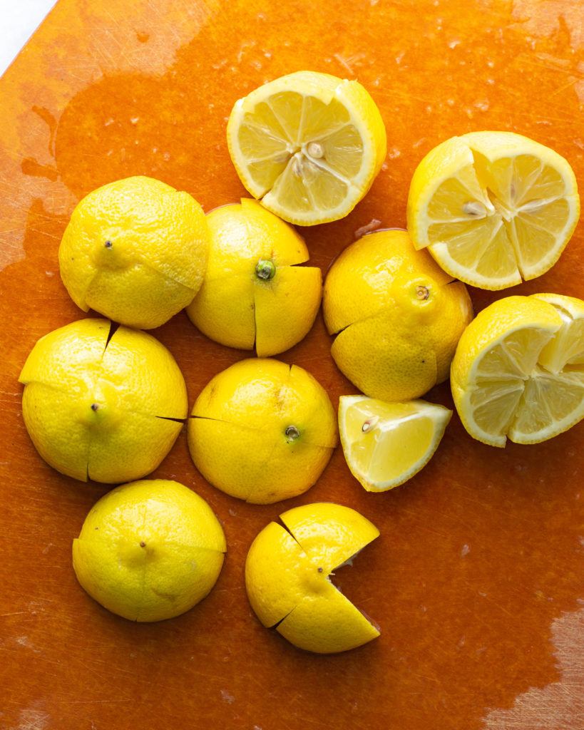 lemons, quartered but not cut all the way through