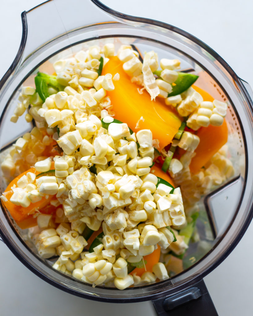 Corn, tomatoes and peppers in food processor