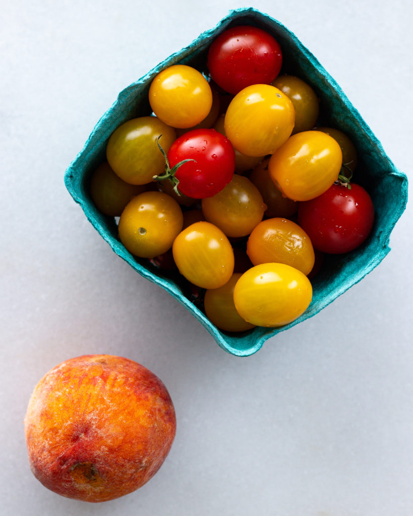 Cherry tomatoes and fresh peach