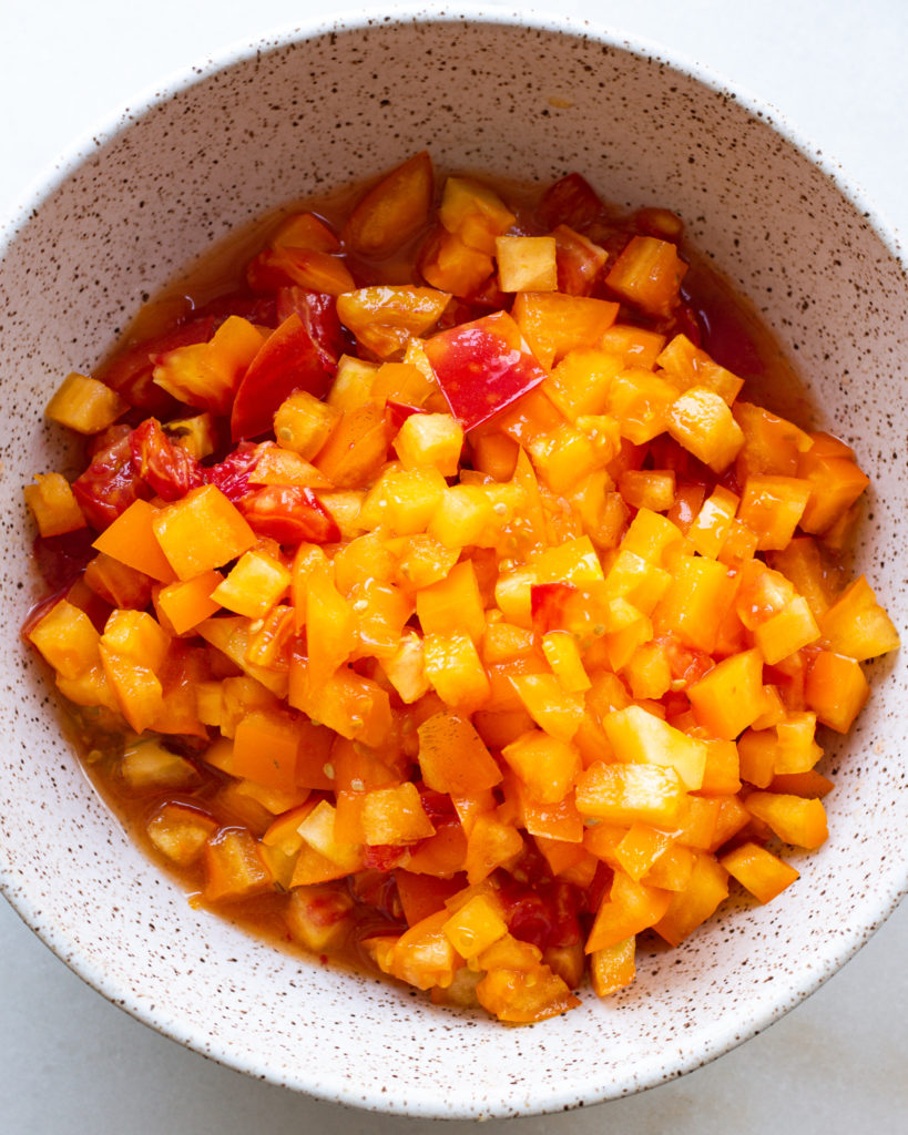Heirloom tomatoes in bowl with vinegar