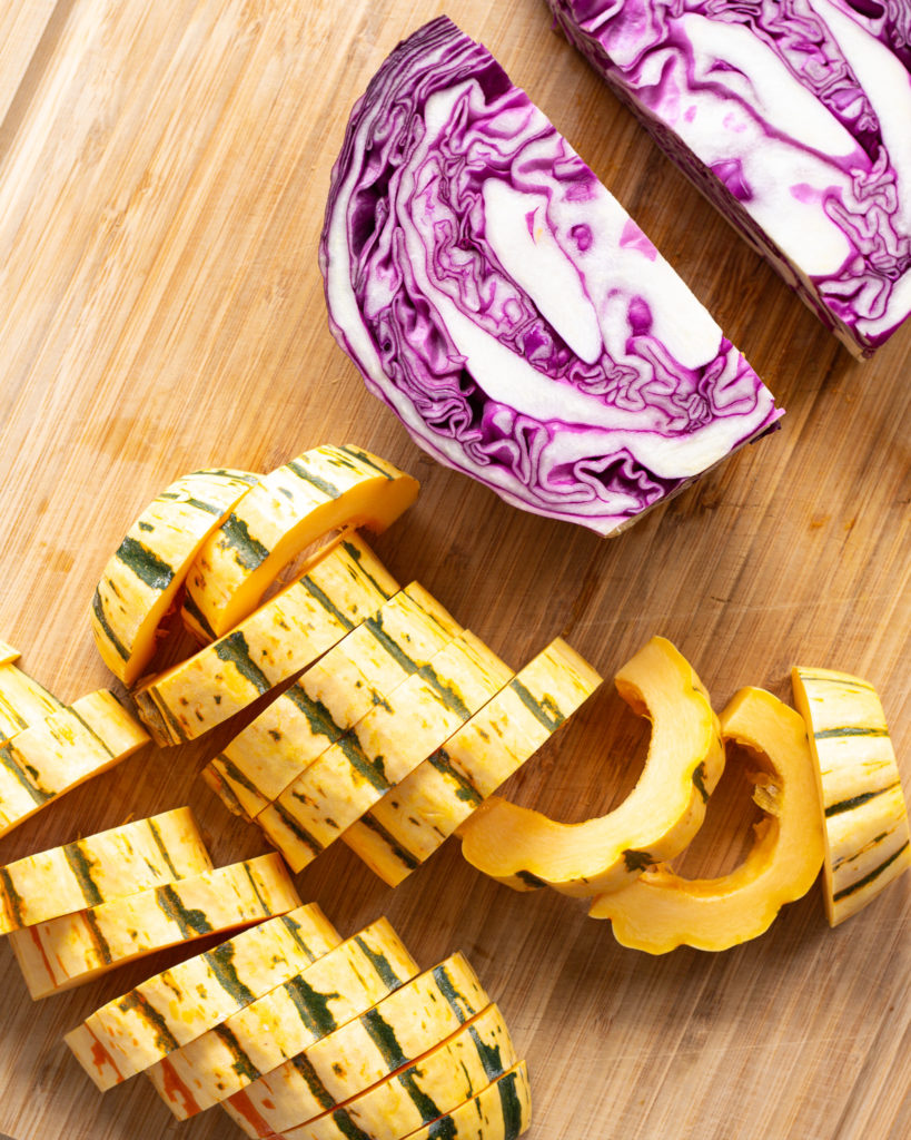 Fresh purple cabbage and delicata squash