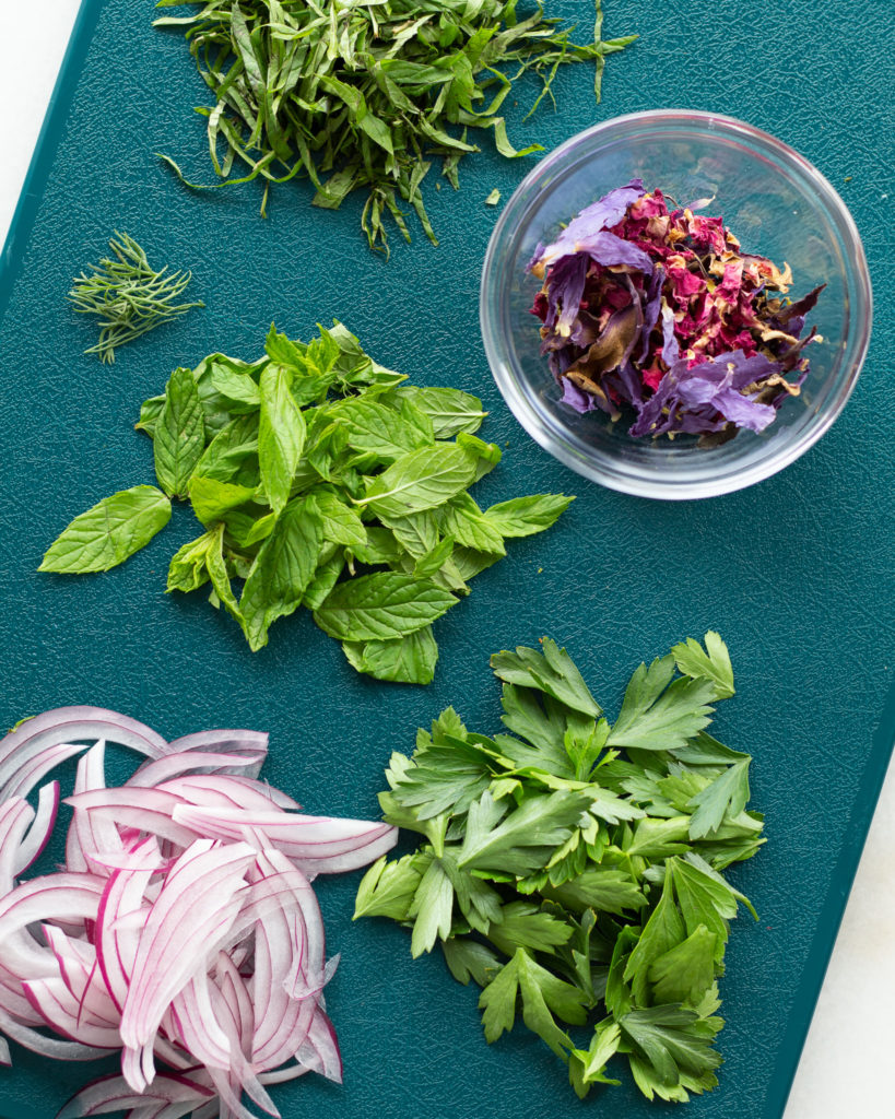 Fresh herbs, red onion and dried edible flowers