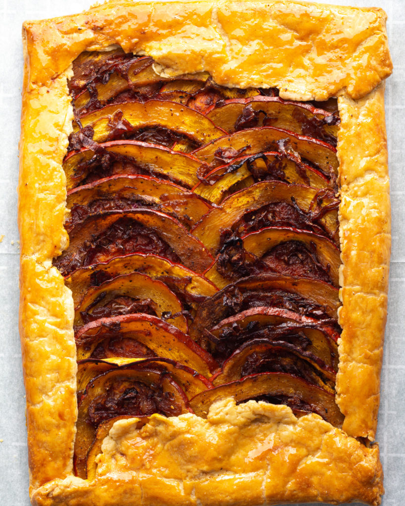 Finished Pumpkin Tart with Caramelized Onions and Pumpkin Seed Gremolata