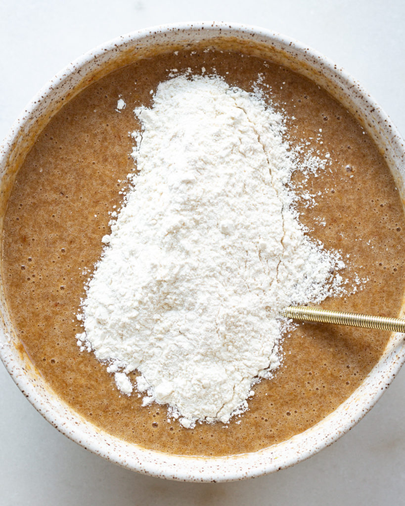 Last bit of dry ingredients added to batter