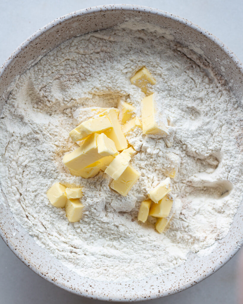 cubed butter an dry ingredients in a bowl