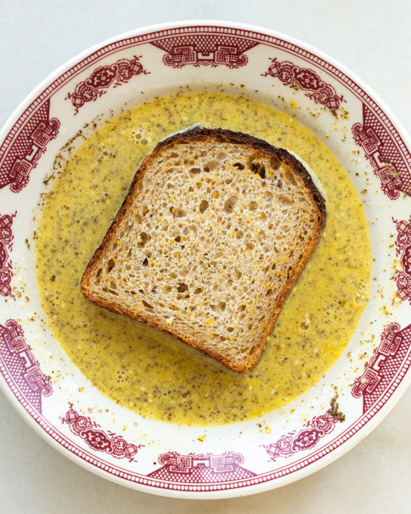 whole wheat bread dredged in egg mixture for savory french toast