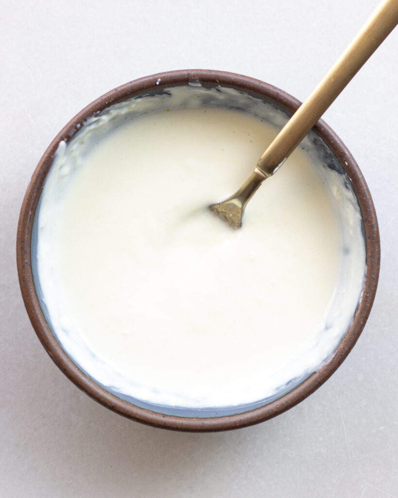 Garlic lime dressing in bowl