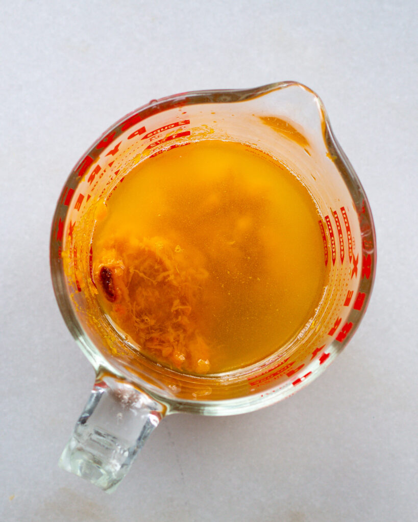 Honeynut broth in measuring cup