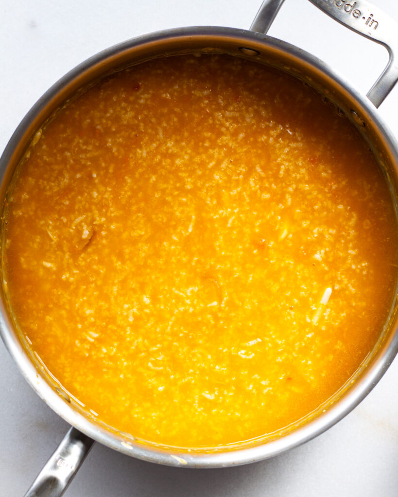 Broth in measuring cup