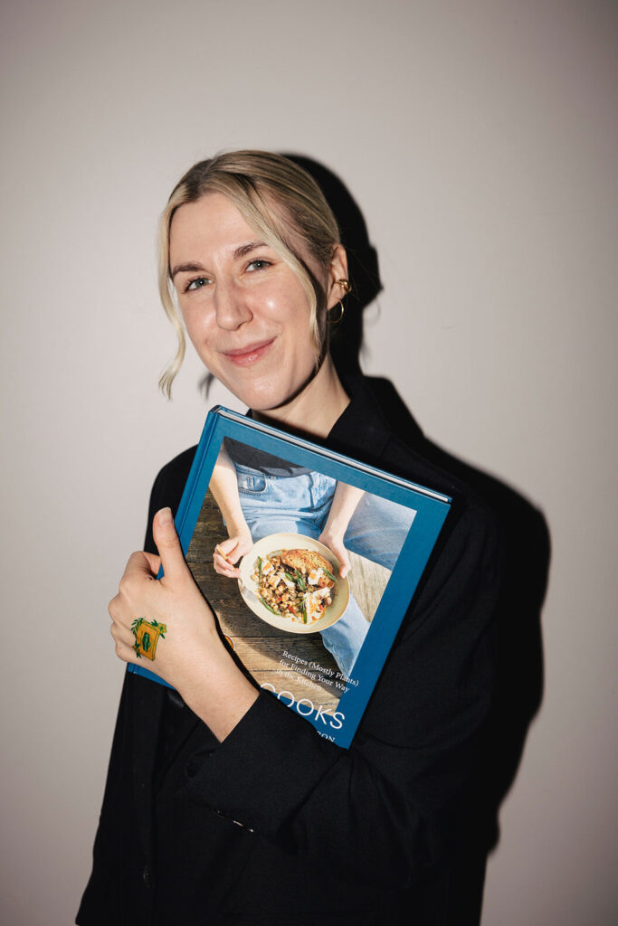 Justine holding her cookbook