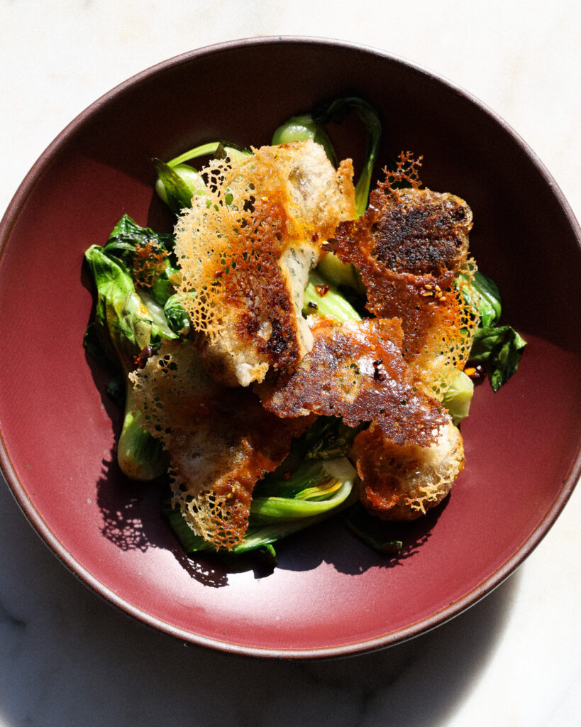 a plate of edamame dumplings with a dumpling skirt