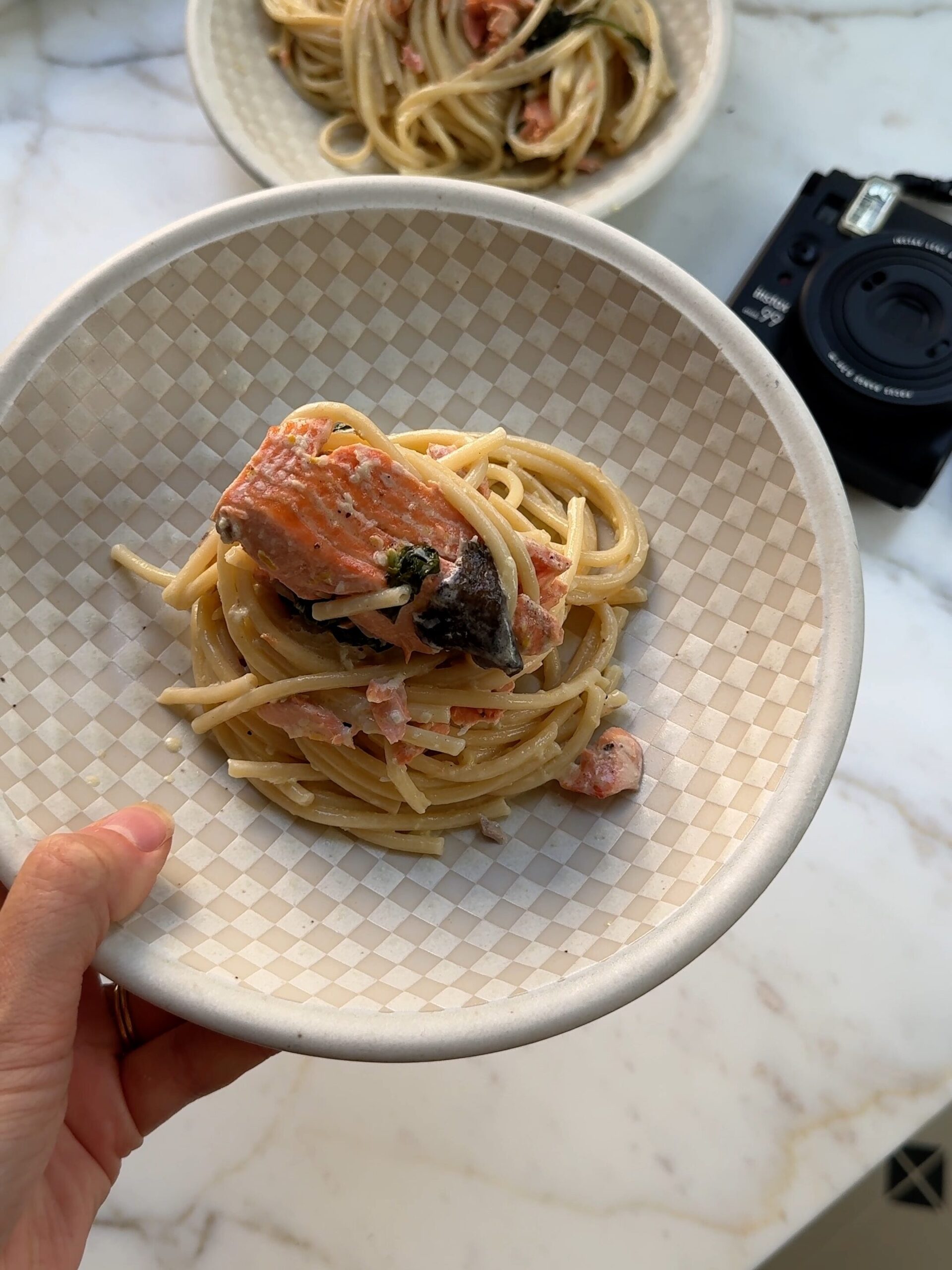 a close up of creamy salmon pasta plates