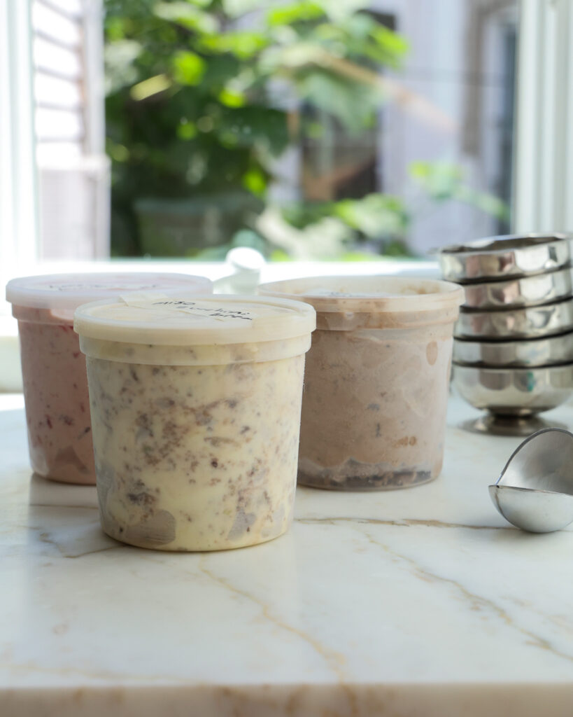 a few ice cream flavors sitting on a counter