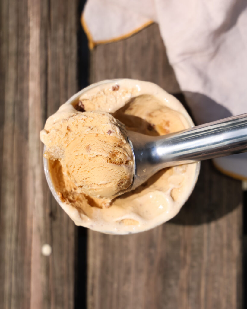 brown butter ice cream being scooped out 