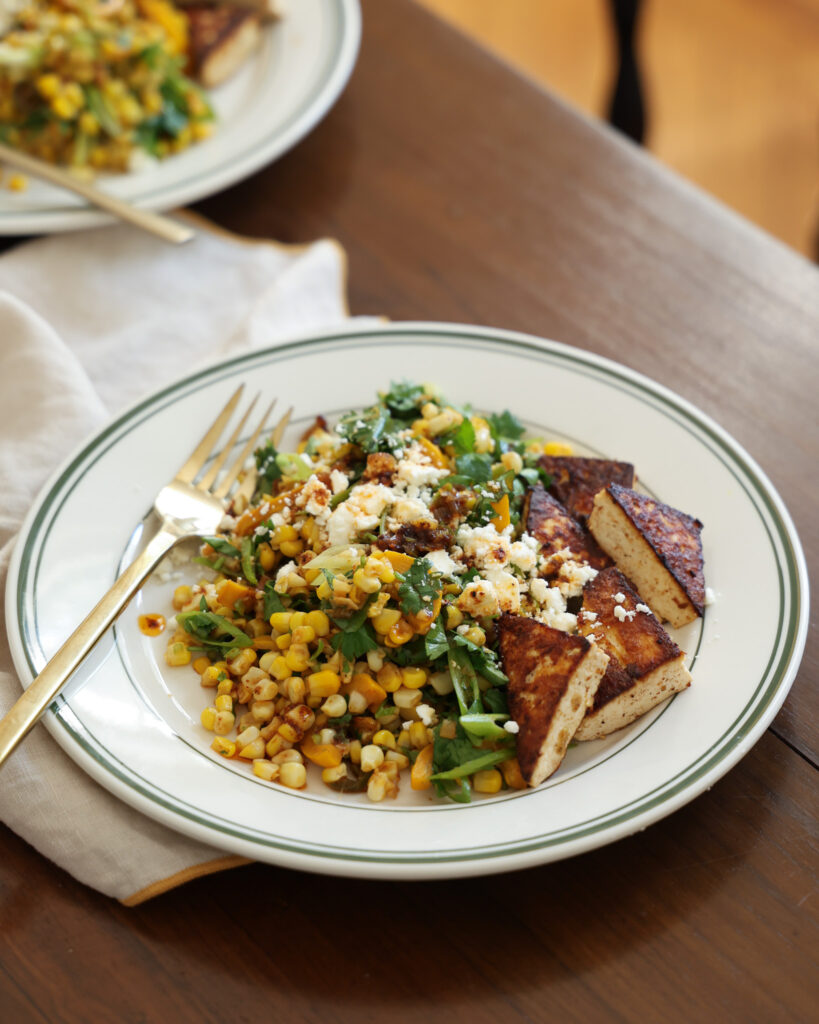corn salad with scallion ancho chili dressing on the dining table