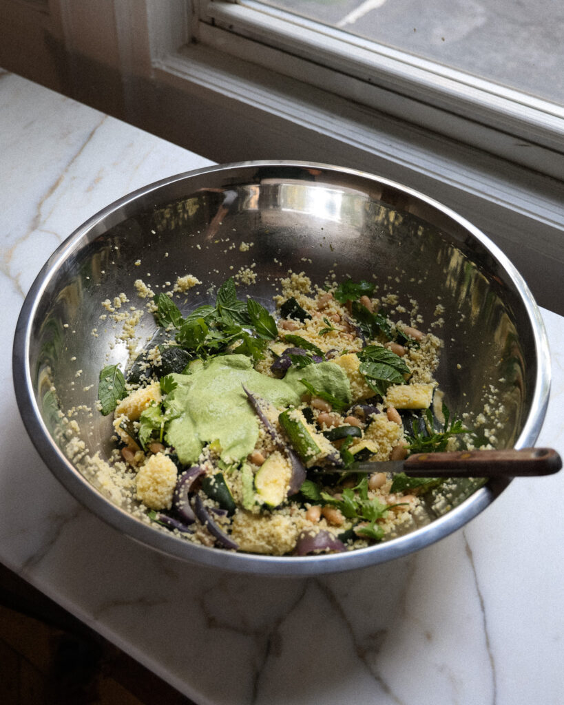 the meal prep couscous salad in a large bowl
