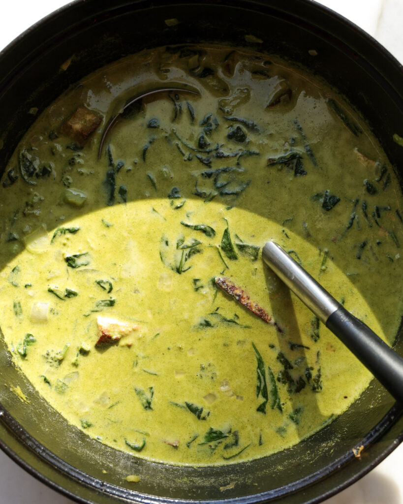 winter greens soup in a dutch oven.