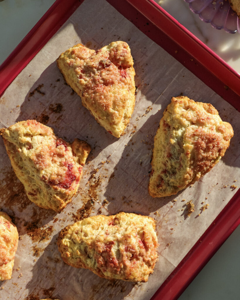 Roasted berry scones on a baking sheet.