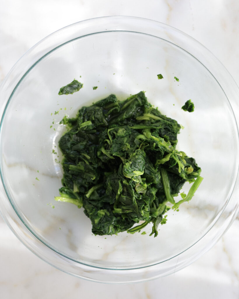 wilted spinach in a bowl.