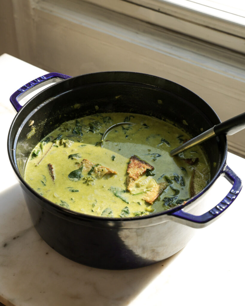 winter greens soup in a dutch oven.
