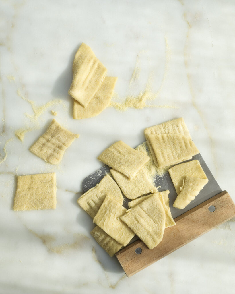 homemade half-ravioli dusted with semolina flour.