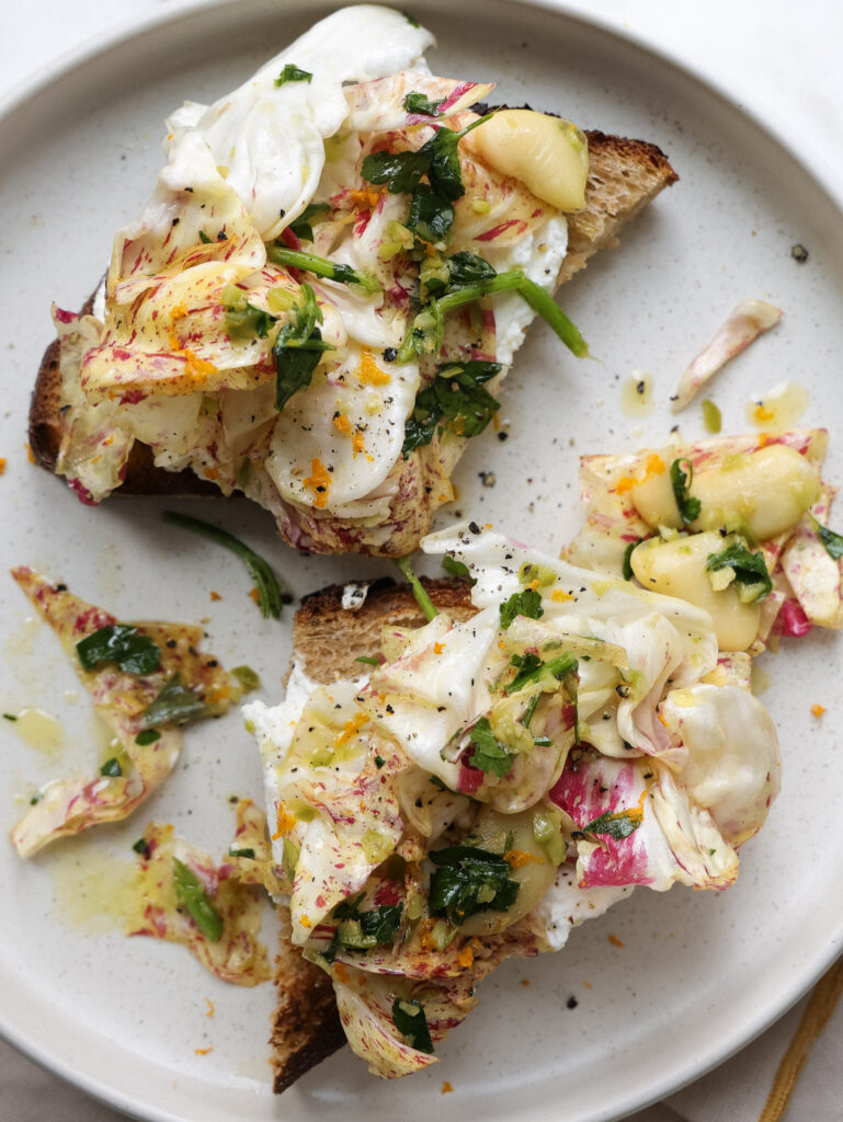 chicory salad on top of ricotta toast
