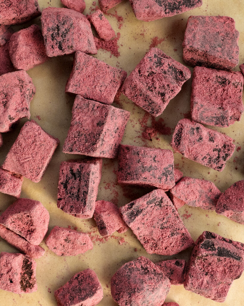 strawberry latte chocolate truffles on parchment paper.