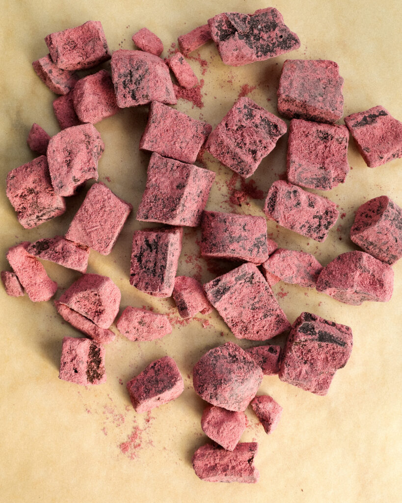 chocolate strawberry truffles on parchment paper.