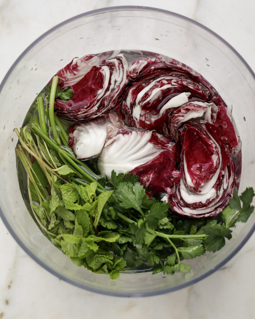 radicchio and herbs in ice water