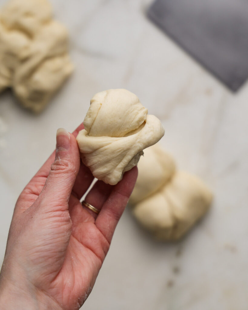 vegan brioche dough being shaped.