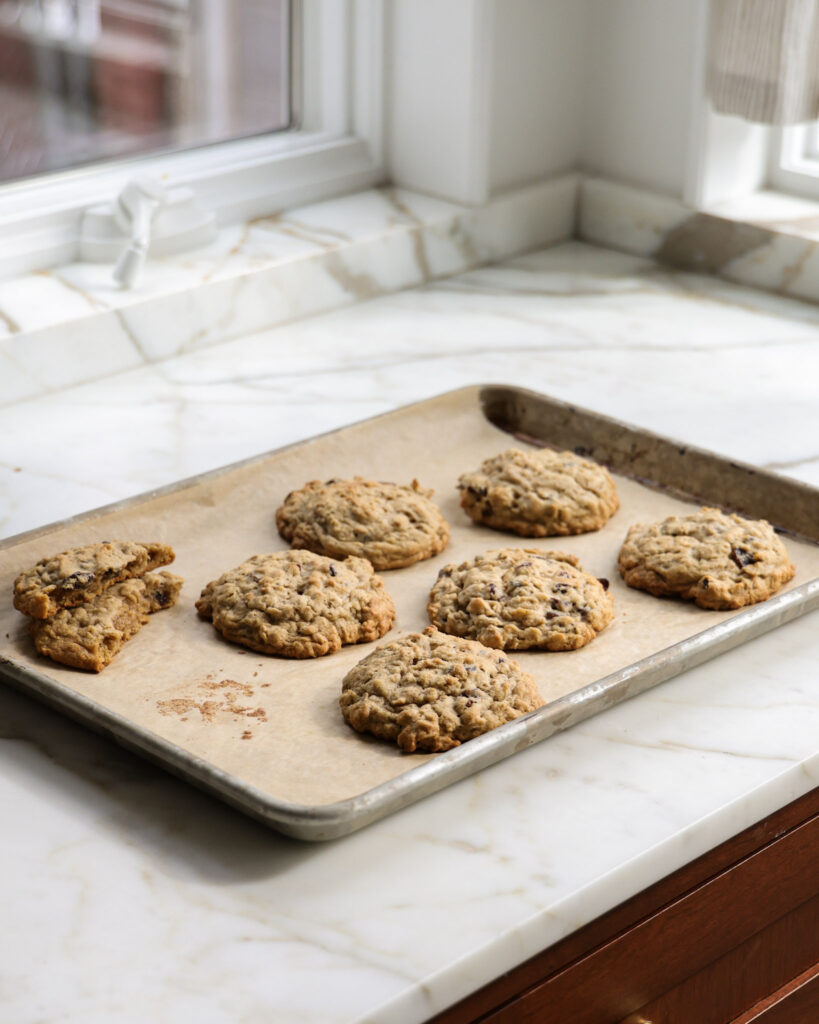 baked brown butter oatmeal raisin cookies on baking sheet.