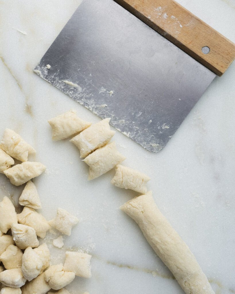 cauliflower pasta dough being cut.