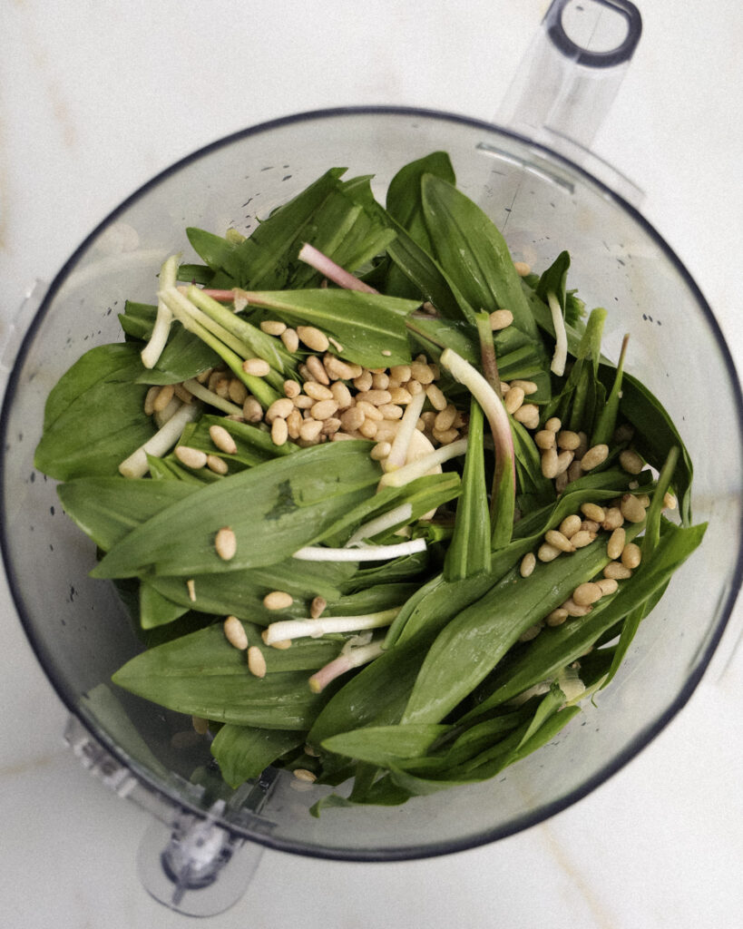 ingredients for ramp pesto in a food processor.