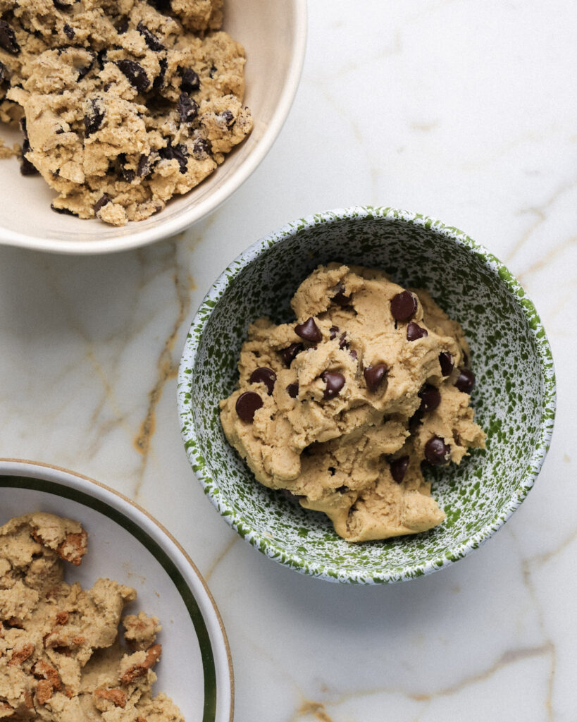 Gideon's Bakehouse cookie dough divided into 3 bowls.