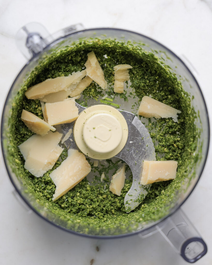 parmesan and carrot tops in a food processor.