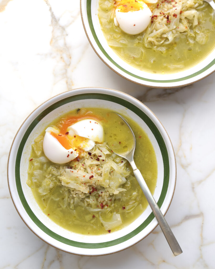 ramp soup in a bowl topped with a soft boiled egg.