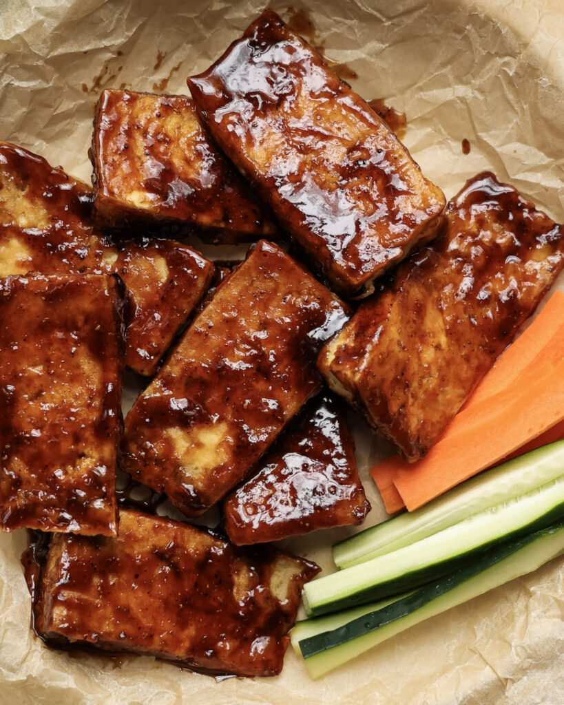 honey coriander tofu wings served with carrots.