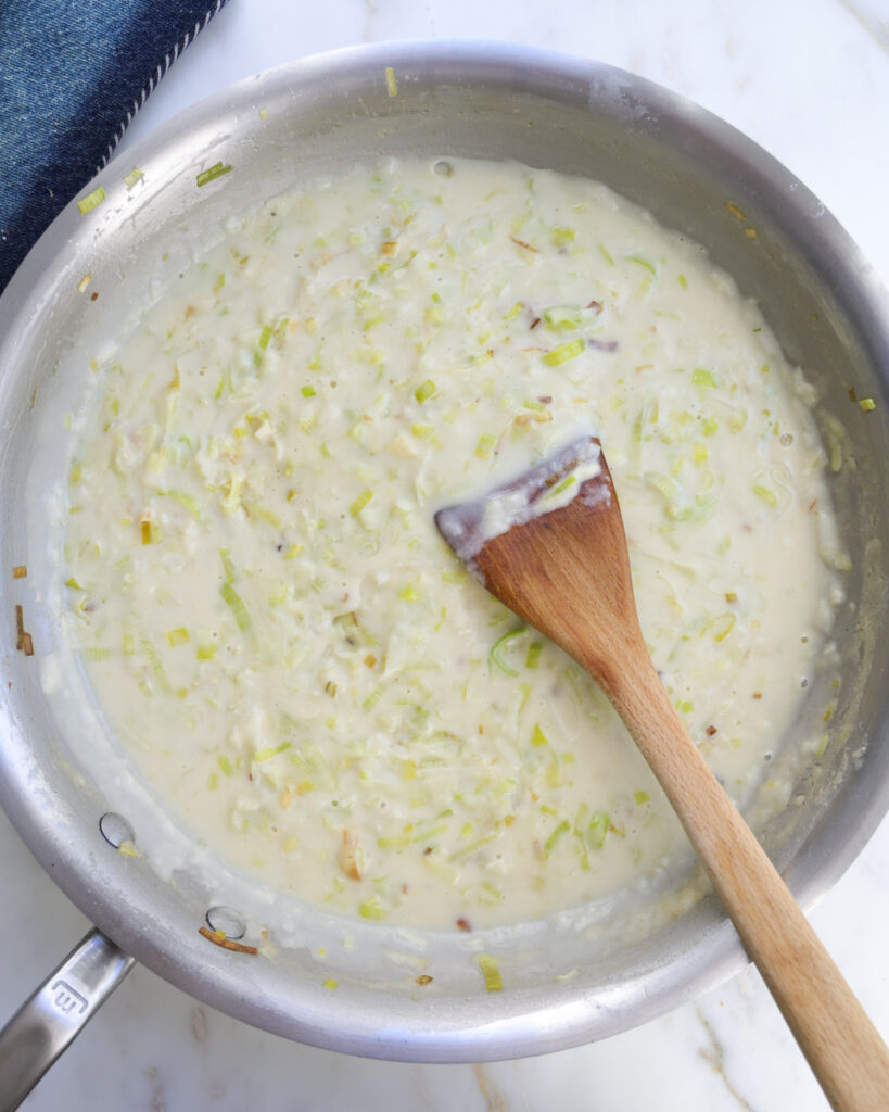 creamy leek pasta sauce in a pan.