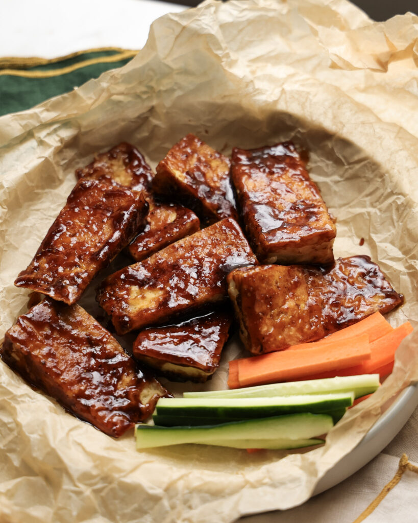 honey coriander tofu chicken wings served with carrots and zucchini.