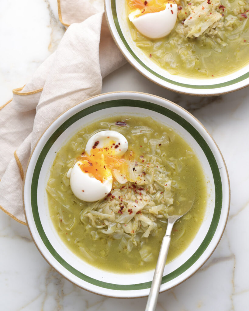 ramp soup in a bowl topped with a soft boiled egg.