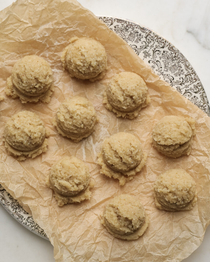 edible sugar cookie dough balls on a plate.
