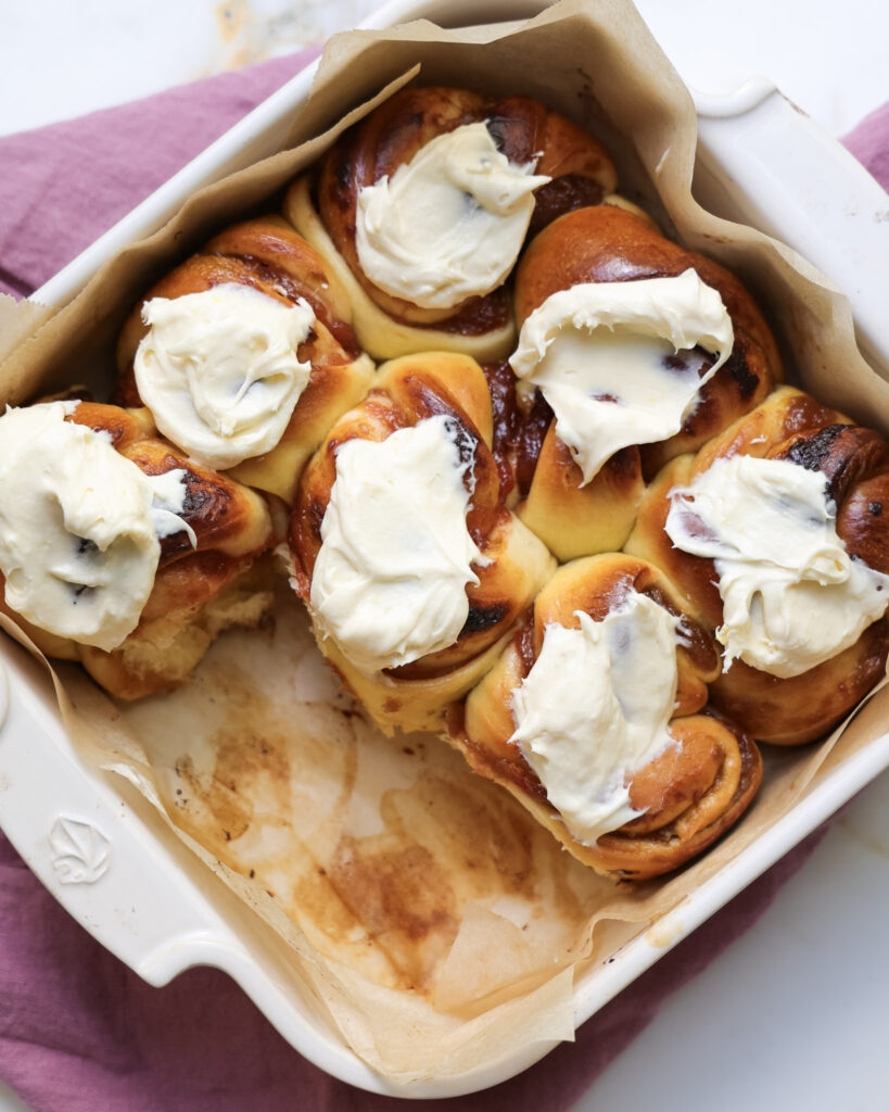 Rhubarb rolls topped with lemon cream cheese frosting.