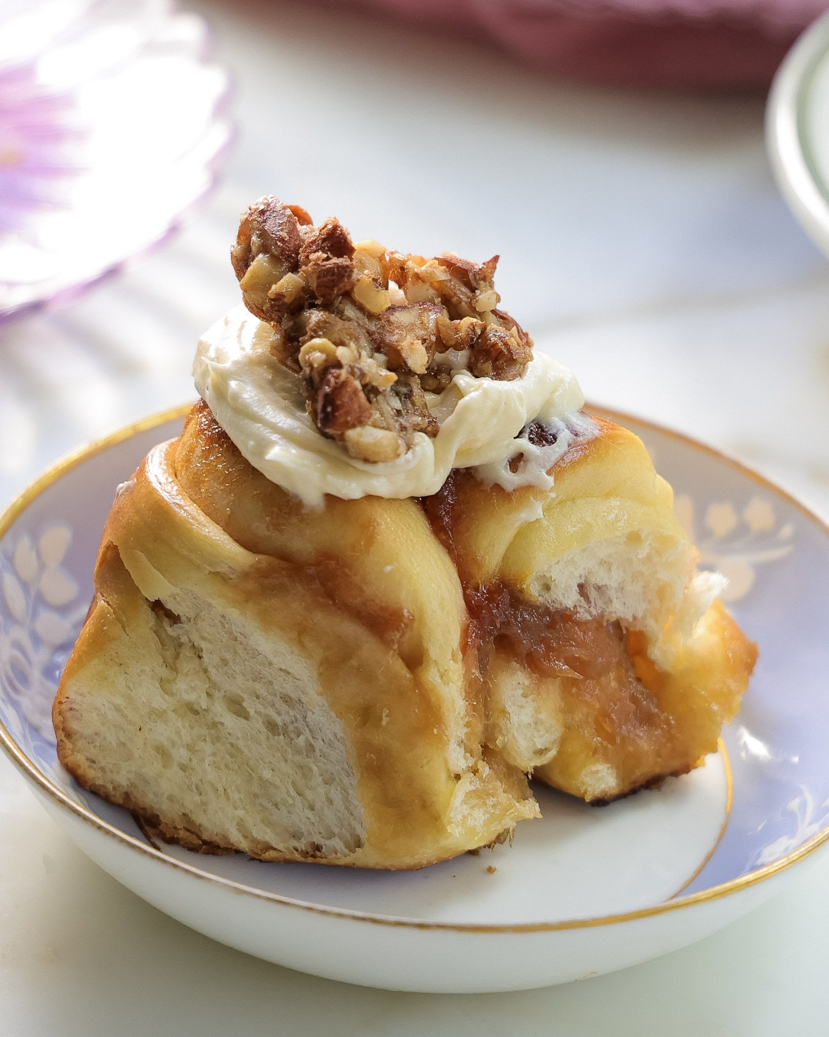 Rhubarb rolls topped with ginger nuts and lemon frosting.
