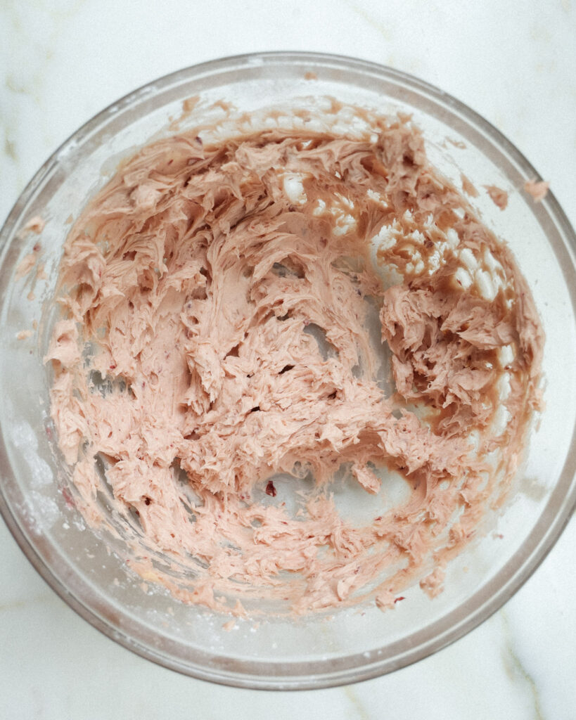 Ingredients for strawberry jam cookies in a bowl.